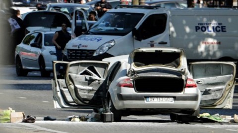 Man plows car loaded with explosives into police van on Champs-Elysees