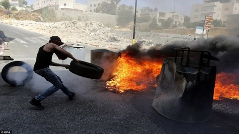 Israeli soldiers shoot dead a knife-wielding Palestinian man before police fire tear gas at angry crowds amid tension over Jerusalem holy site