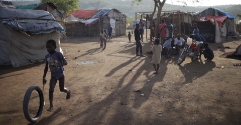 A boy plays at a refugee camp for Haitians returning from the Dominican Republic on the outskirts of Anse-a-Pitres, Haiti, on September 7, 2015. Photo: Andres Martinez Casares / Reuters