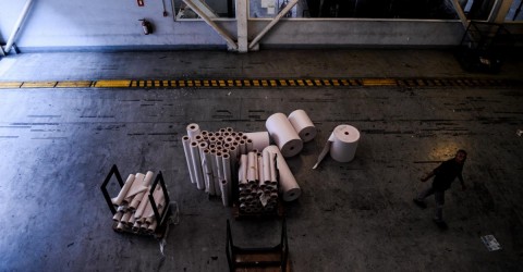 Used up paper rolls, the last remnant of the resource for the "El Nacional" newspaper printed edition