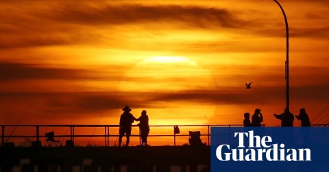 Sunrise over Altona pier in Melbourne on Thursday. Weather temperatures are set to soar as a heatwave stretches across Australia. Photo: David Crosling/AAP