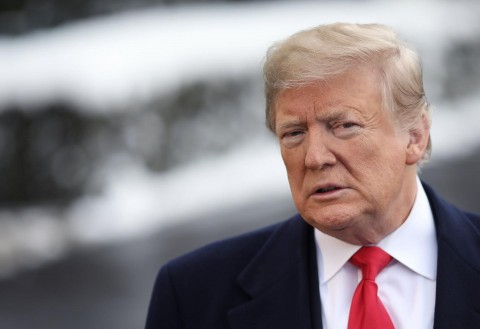 President Donald Trump answers questions from the press as he leaves the White House on January 14 in Washington, D.C. Photo: Win McNamee/Getty Images