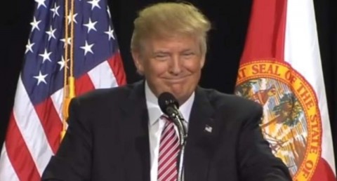 Donald Trump smiles after a heckler is ejected from his campaign rally in Kissimmee, Florida on Aug. 11, 2016. Photo: YouTube screengrab)