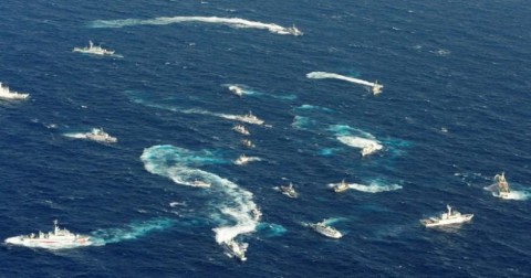 An aerial view shows Japan Coast Guard patrol ship, fishing boats from Taiwan and Taiwan's Coast Guard vessel sailing side by side near the disputed islands in the East China Sea, known as Senkaku in Japan, Diaoyu in China and Tiaoyutai in Taiwan