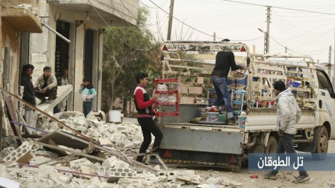 In this photo provided Jan. 4, 2018, Syrian citizens load their belongings onto a pickup as they flee their house which was attacked by Russian airstrikes, in Tel al-Toukan village, eastern Idlib province, Syria. (AP)