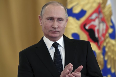 Russian President Vladimir Putin applauds during an award ceremony in the Kremlin,Thursday, Dec. 28, 2017. (Kirill Kudryavtsev/Pool Photo via AP)