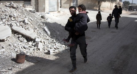 Syrians flee their homes with their belongings in the town of Beit Sawa in Syria's besieged eastern Ghouta region on March 4, following reported air strikes. Photo: Abdulmonam Eassa/AFP/Getty Images