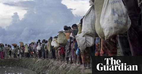 Rohingya refugees walk after crossing the Naf river from Myanmar into Bangladesh in Whaikhyang. Photo: AFP/Getty