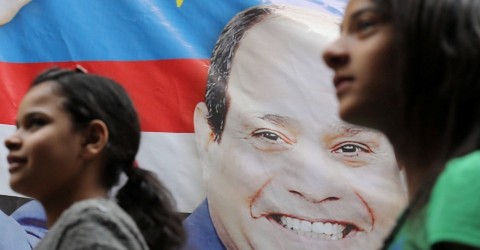 Girls walk by a poster of Egyptian President Abdel Fattah al-Sisi for the upcoming presidential election, in Cairo, Egypt March 19, 2018. Photo: Mohamed Abd El Ghany / Reuters