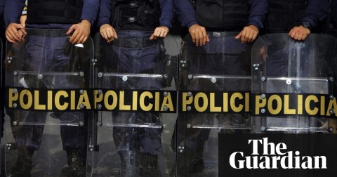 Police officers in Brazil stand guard. Photo: Fernando Bizerra Jr./EPA