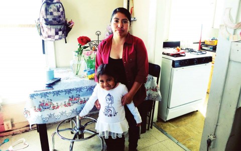 Rosalina Hernández lives with her daughter and four other family members in a one-bedroom apartment in South Central LA. Photo: Bryce Covert