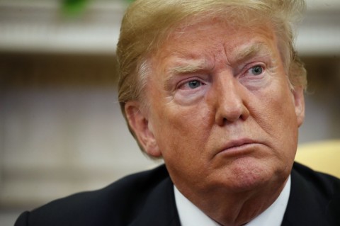 President Donald Trump sits with Joshua Holt, who was recently released from a prison in Venezuela, at the White House, May 26, 2018. Photo: Alex Brandon/AP