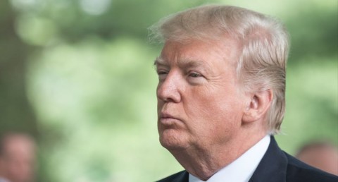 President Donald J. Trump listens to an event brief for the Presidential Armed Forces 