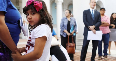 Ariely Murrilo, a US citizen, holds the hand of her mother, a TPS holder from El Salvador, in Los Angeles in August. Photo: Mario Tama/Getty