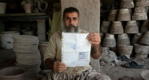 Bloody violence threatens this weekend's parliamentary election in Afghanistan, but potter Shirin Agha, 45, says he is determined to cast his ballot. Photo: AFP