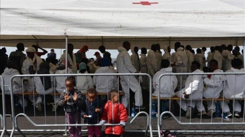 Immigrant children in a dining room in Italy