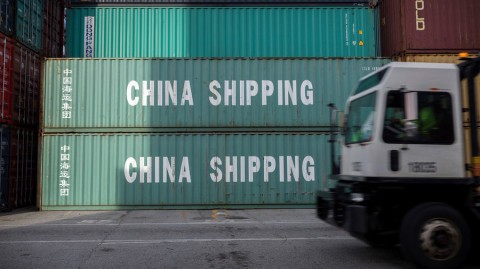 A truck passes a stack of 40-foot containers at the port of Savannah, Georgia. Photo: AP